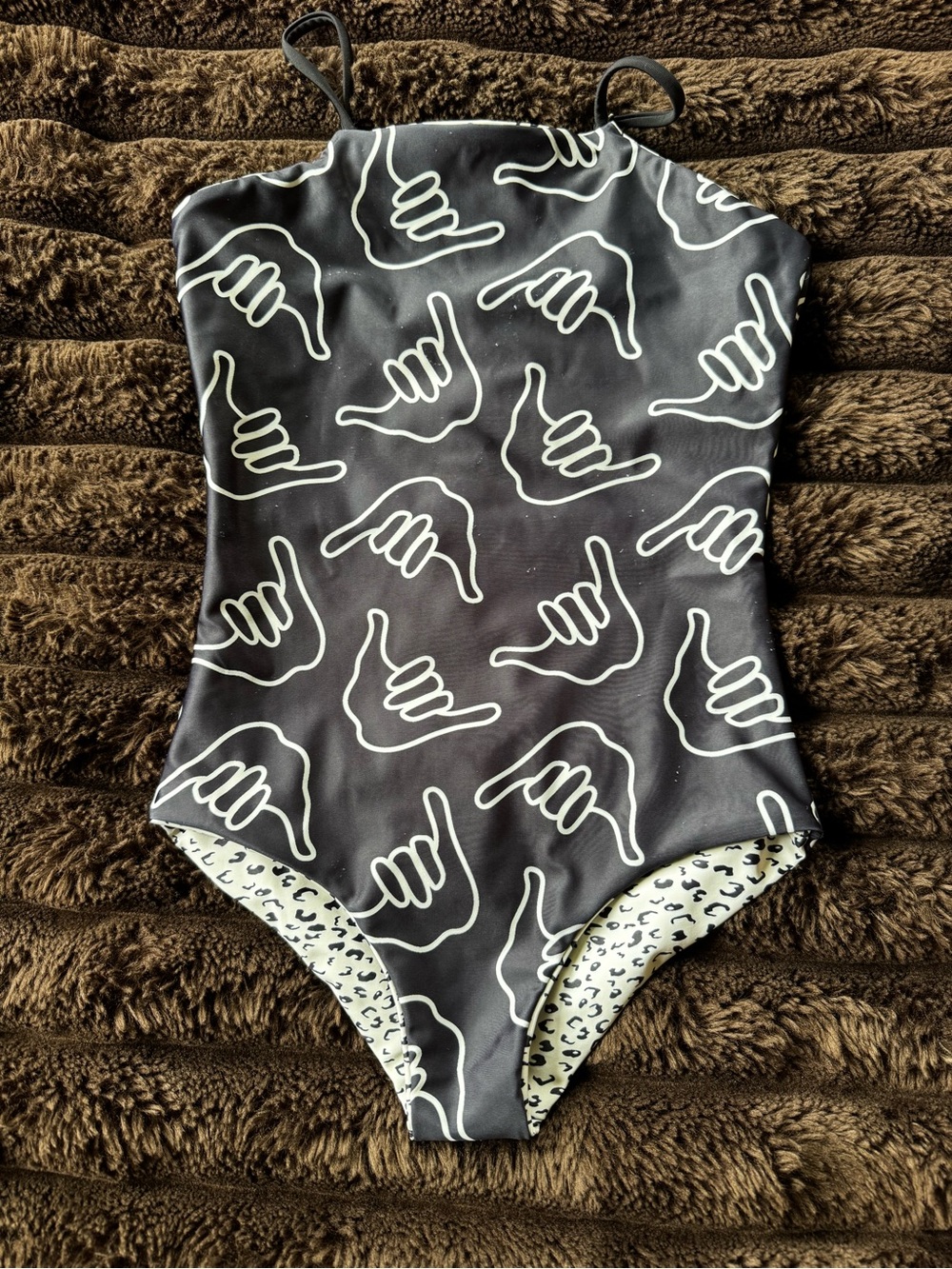 Of one sea Black One-Piece reversible Swimsuit with White Shaka Print
